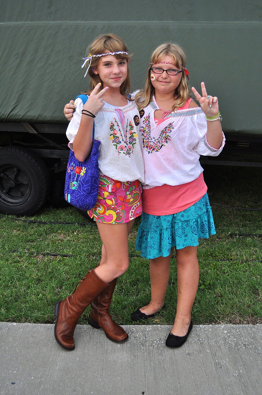 Canyon Jones, 9, and Emma Fett, 10, dressed in some 60â€™s inspired clothing Friday, July 15 at Friday Fest at the Van Wezel.