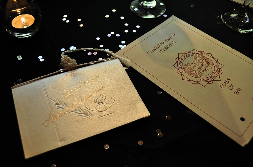 A graduation announcement card and the commencement program were on one of the many tables full of memorabilia Saturday, July 23 during Riverviewâ€™s 20-year reunion at Michaelâ€™s on East