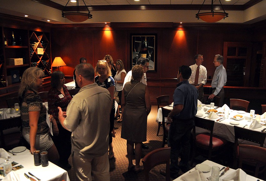 Members of the LLSA Chamber of Commerce chat prior to lunch Thursday, July 28 at Fleming's.