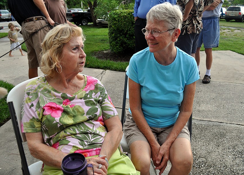 Maxine McLawhorn and Mary Noren talk to one another Thursday, July 28 during the Alta Vista neighborhood picnic at Payne Park.