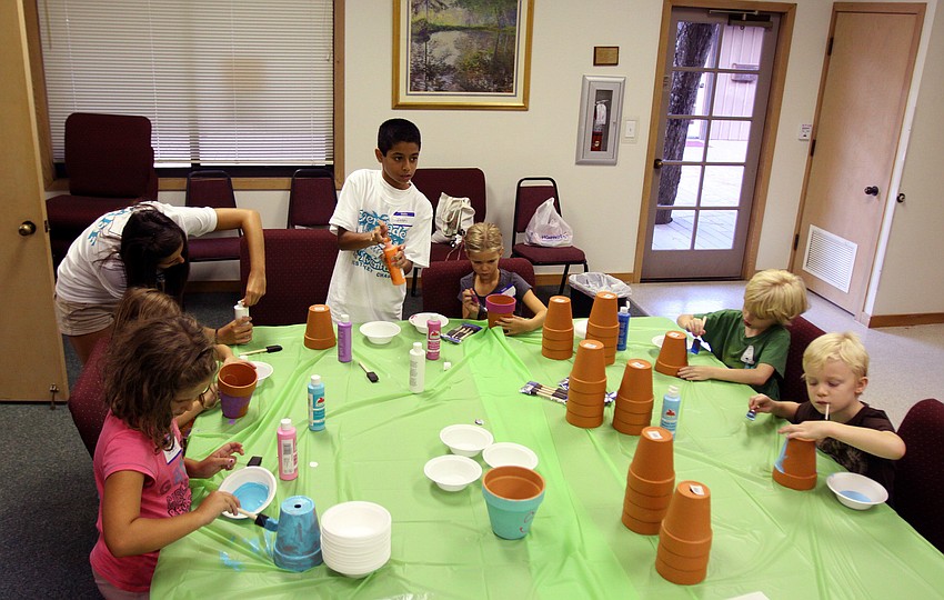 The Herons were the first group to work in the craft room Monday, August 8 during vacation bible school at Siesta Key Chapel. The group painted flower pots and will be planting seeds in their pots later in the week.