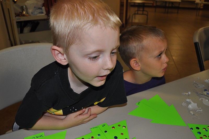 Jacob Neisen worked hard on his Christmas tree craft.