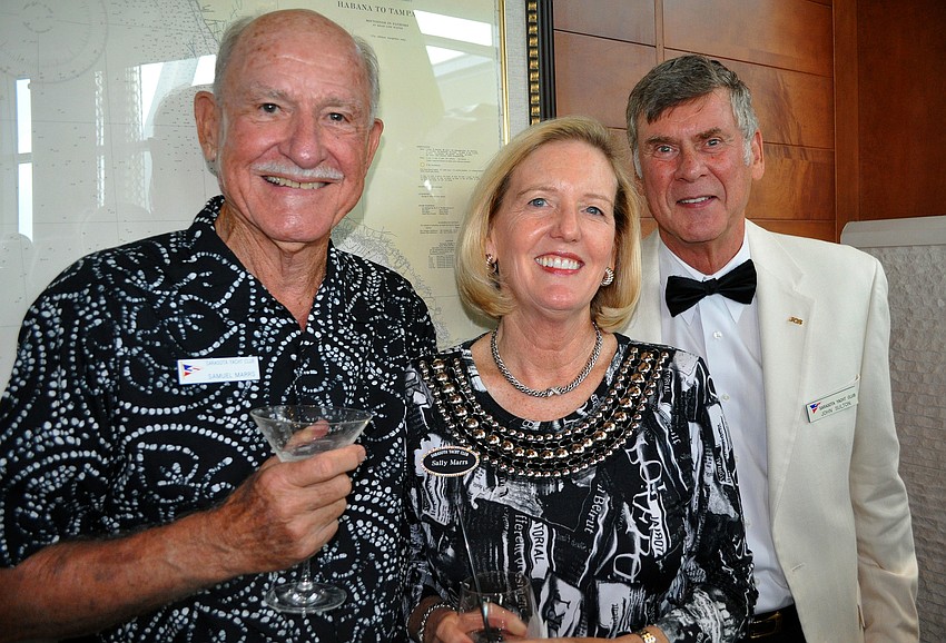 Sam and Sally Marrs pose with John Sulton at the SYC Black & White Ball Saturday, August 13 at the Sarasota Yacht Club.