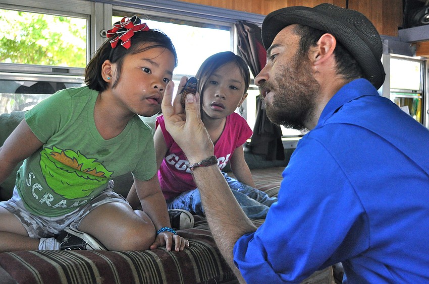 Hanna and Maya Rudo listen to 