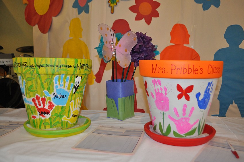 Flower pots decorated by First Presbyterian Preschool students were auctioned off to raise money for the preschool.