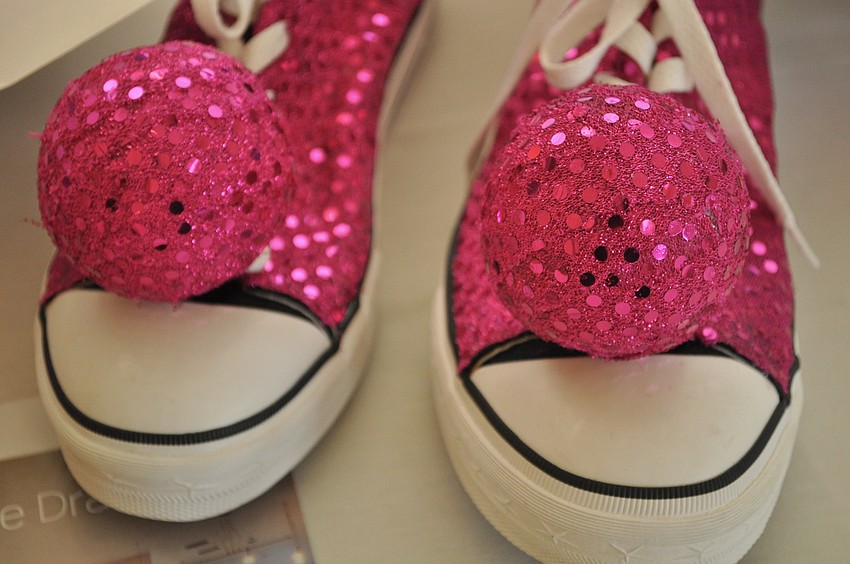 One item up for auction was a pair of hot pink sneakers.