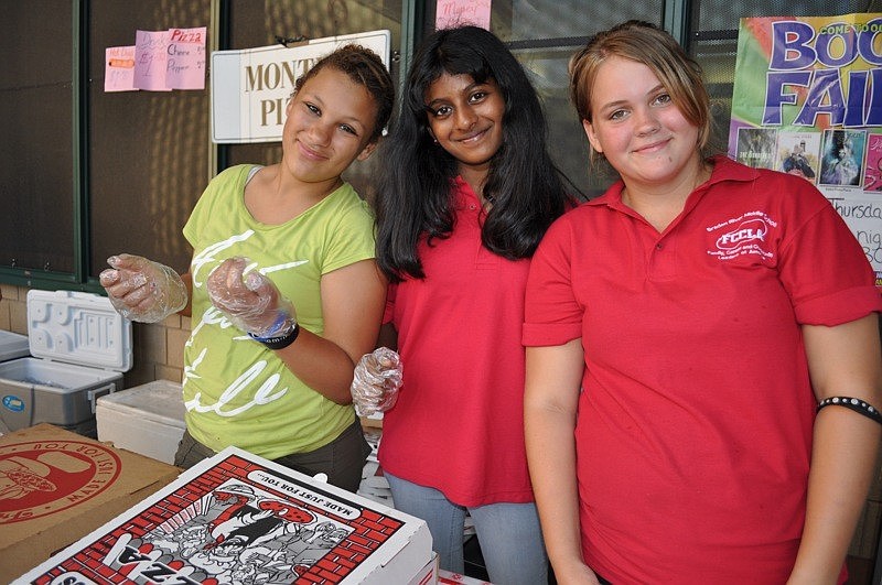 FCCLA members Caroline Robinson, Varshini Gali and Kati Moeckel dished out pizza.