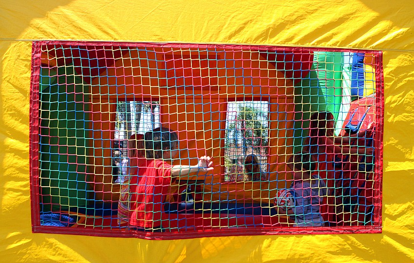 Kids play inside a bounce house on Sunday, April 17 during South Bay's Family Fun Day.