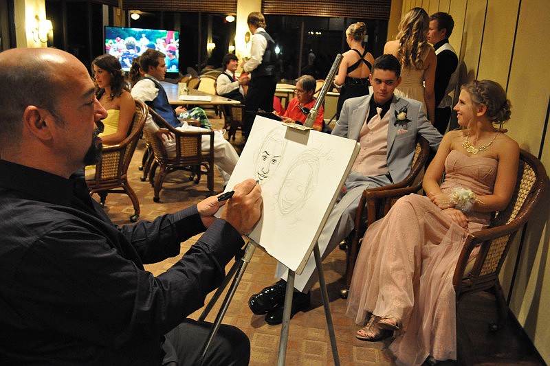 Artist Michael White sketches Lucas Friss and Lydia Scheufler