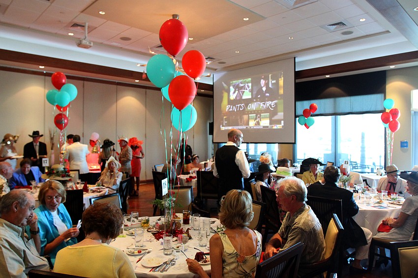 People enjoy dining, betting and watching coverage of the Kentucky Derby on Saturday, May 7 at the Kentucky Derby party at the Sarasota Yacht Club.