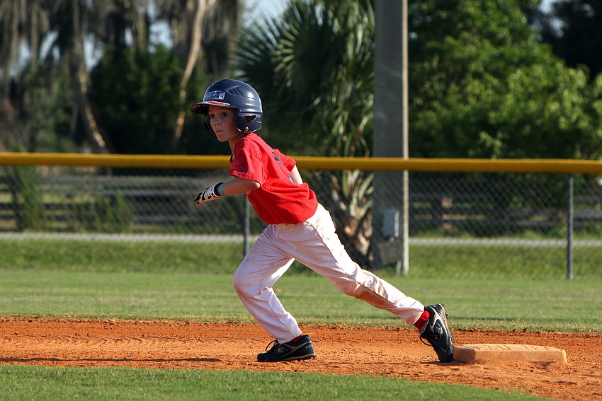 Evan Crisp gets ready to run to third during the final game of the Spring season Monday, May 9 out at Twin Lakes Park.