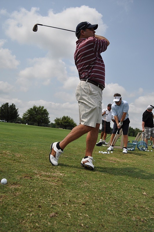 Tony Panico got in some practice at the driving range before the tournament started.