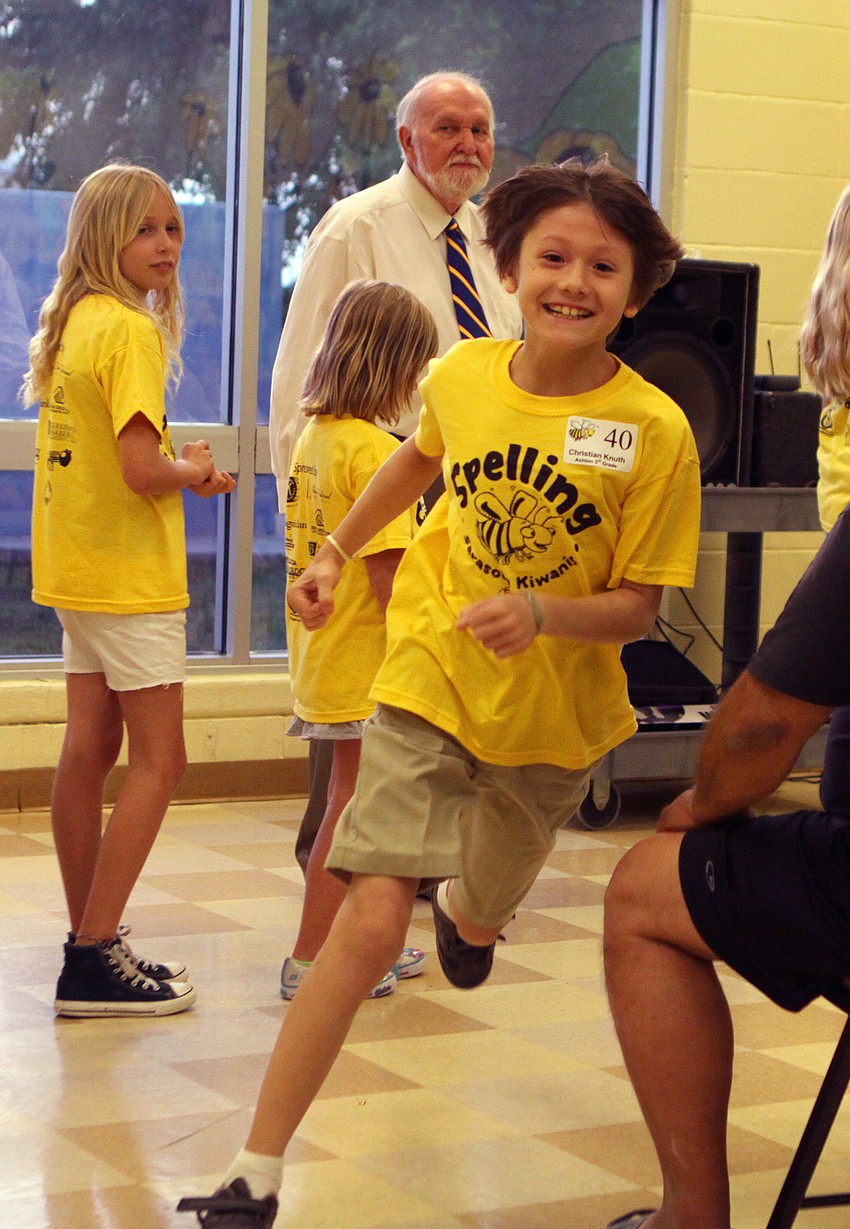 Christian Knuth, a 3rd grader from Ashton, runs excitedly to the back of the correct spellers line after getting a difficult word correct.