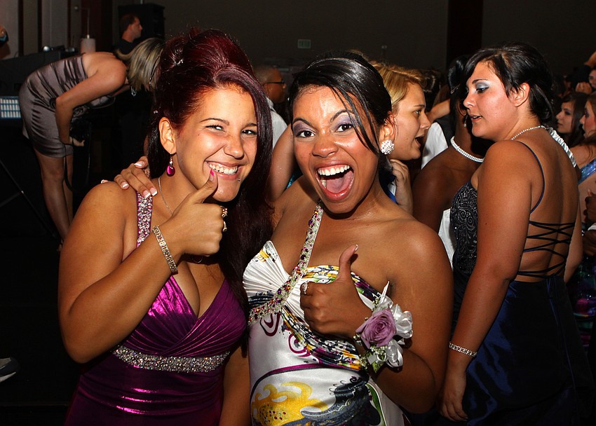 Laisy Almanza and Maria Arrate give two thumbs during Sarasota High School's prom.