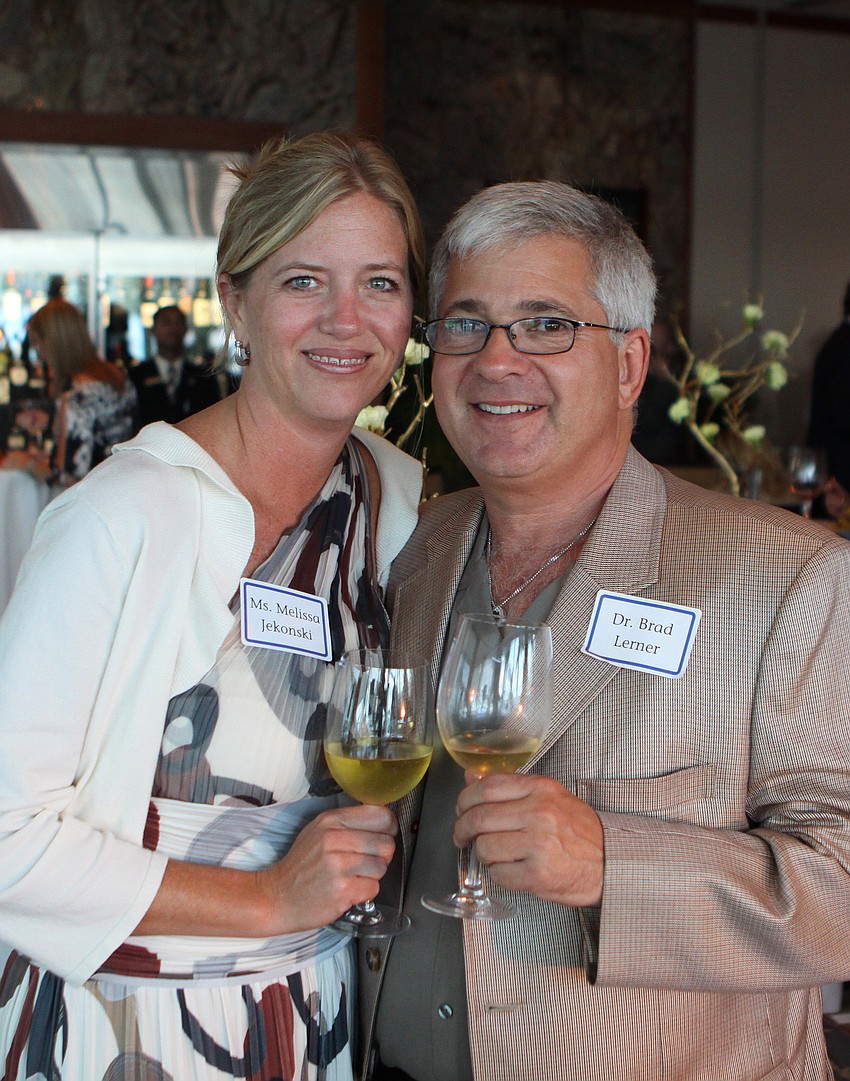 Melissa Jekonski and Dr. Brad Lerner pose together with their wine Tuesday, May 17 during the 