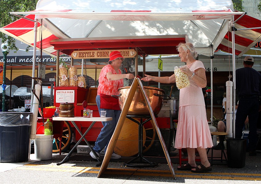 Many people bought kettle corn to enjoy while they wandered the Craft Festival Sunday, May 22 along Main Street and in Five Points Park.