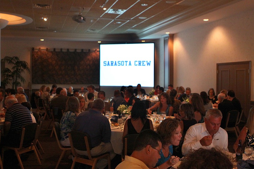 People begin eating their salads at Sarasota Crew's Night of The Stars Sunday, May 22 at Michael's on East.
