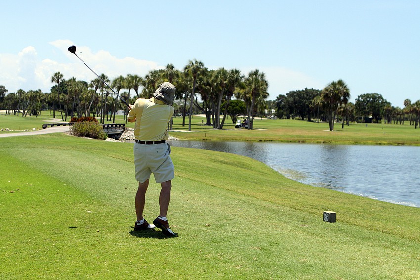 Bryan Fritz watches his ball after following through on his swing while playing in the 2011 Longboat Key Invitational Friday, May 27 at the Longboat Key Club Islandside.