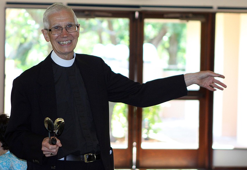 Fr. David Danner tried to get the attention the crowd by banging spoons together instead of clinking a spoon and glass Sunday, June 5 during the All Angels brunch.