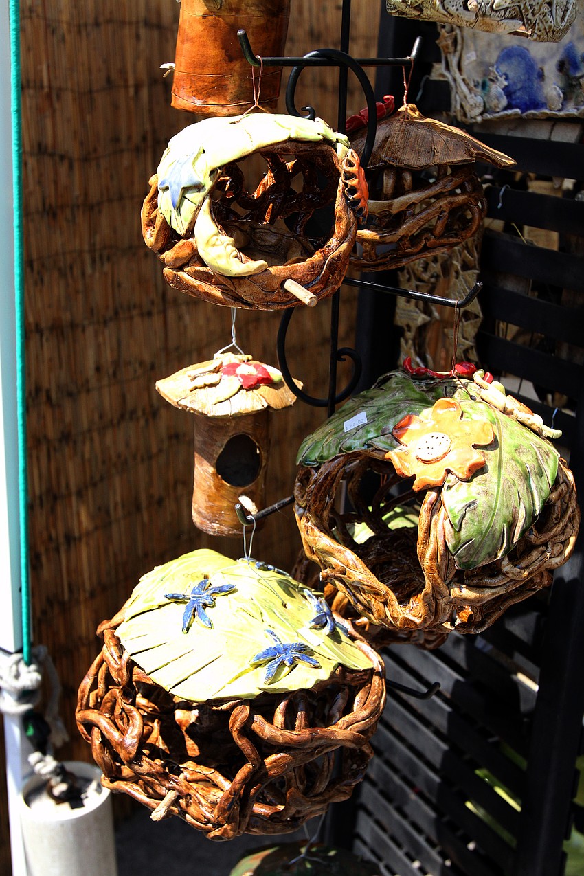 Lora Thomas' tropical bird houses were hanging on display at the 10th Annual St. Armands Craft Festival Saturday June, 11 at St. Armands Circle.