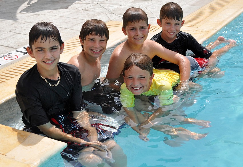 Dakota Holton, 13, Josh Clark, 10, Justin Clark, 9,  Stetson Holton, 10, and Dillion Holton, 10, have some fun in the pool.