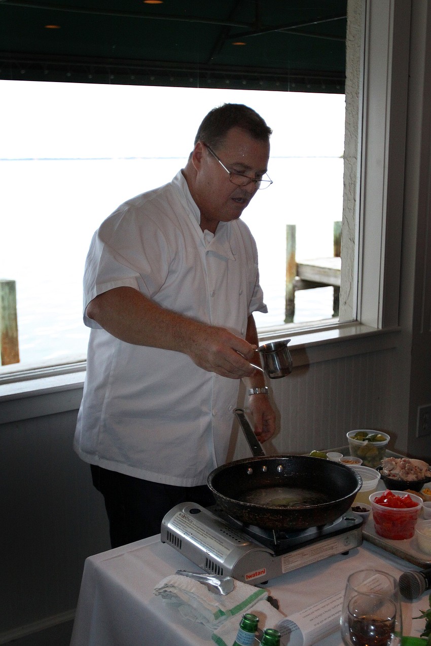Tommy Klauber stood in the middle of the back of the room in order to demonstrate and call out directions Friday, July 22 during the Interactive Mexico dinner at Pattigeorgeâ€™s.