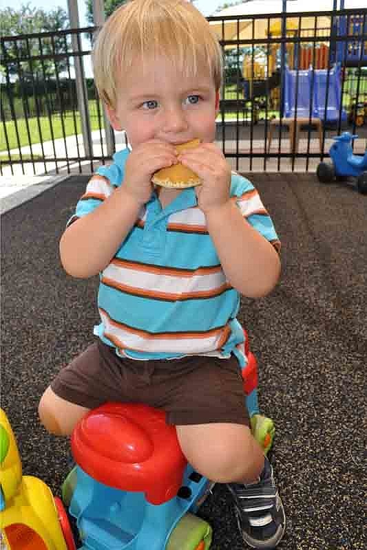 Zane Robertson couldn't decide if he wanted to play or eat a pancake more.