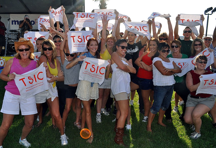 Members of the flash mob showed off and threw towels at the crowd with Take Stock In Children printed on them at the end of their dance.