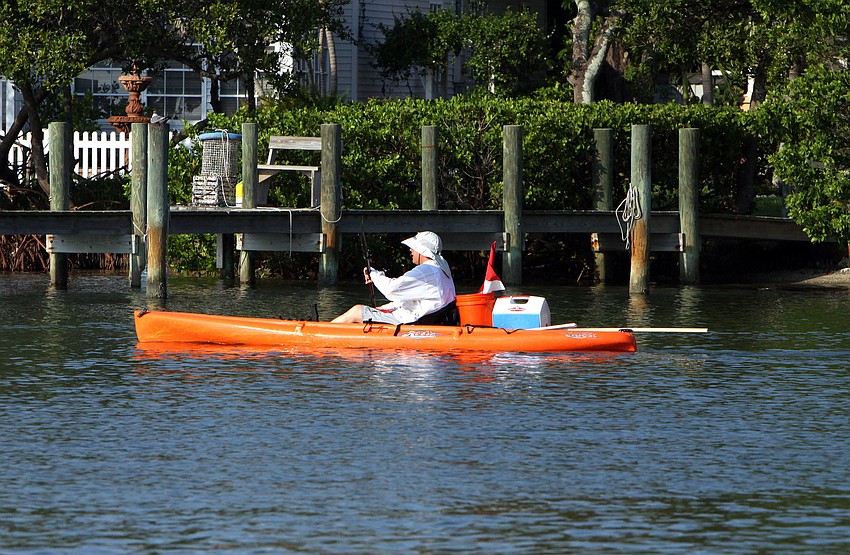 A kayaker makes their way out into the Bay to look for scallops Saturday, August 13 during the 4th Annual Sarasota Bay Great Scallop Search.