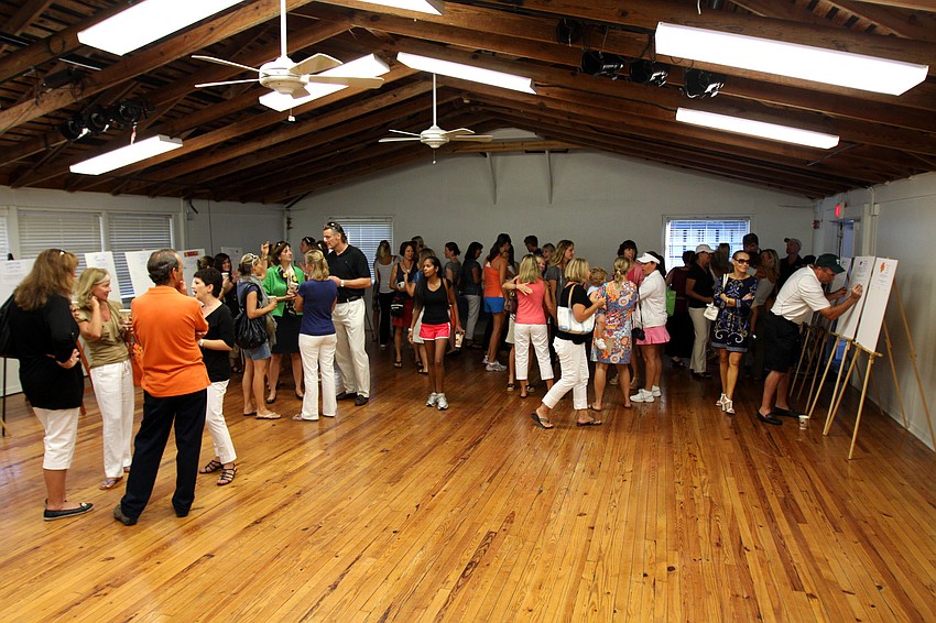Parents gather together for coffee and breakfast treats after seeing their children off to their first day of school.