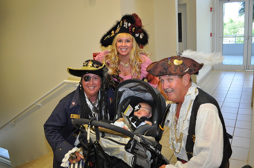 Brian and Suzanne Olsen and Ronald Fisher with Austin Bobb