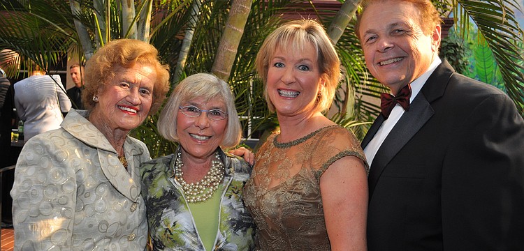 Co-chairs Betty Schoenbaum, Teri Hansen and Dr. Larry Thompson flanking honoree. Gerri Aaron