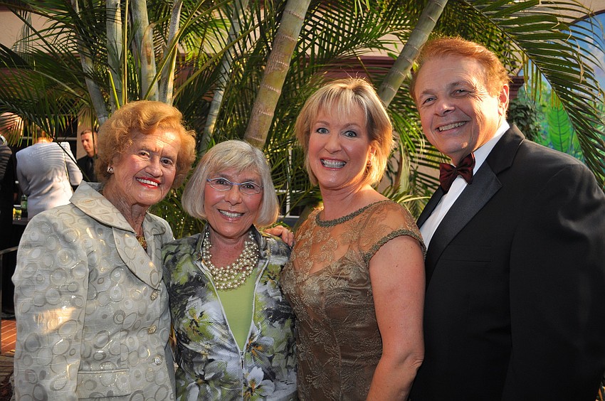 Co-chairs Betty Schoenbaum, Teri Hansen and Dr. Larry Thompson flanking honoree. Gerri Aaron
