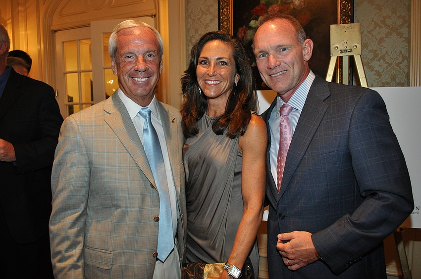 Honoree Roy Williams with Julie and Pat Warren