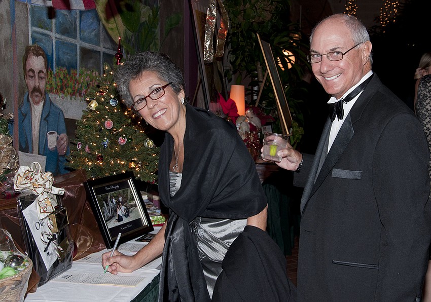 Joann and John Tufaro participating in the silent auction
