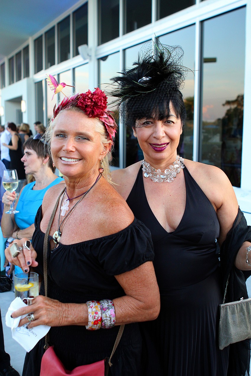 Heidi Lane and Anna Molinari wearing ornate fascinators made by Molinari