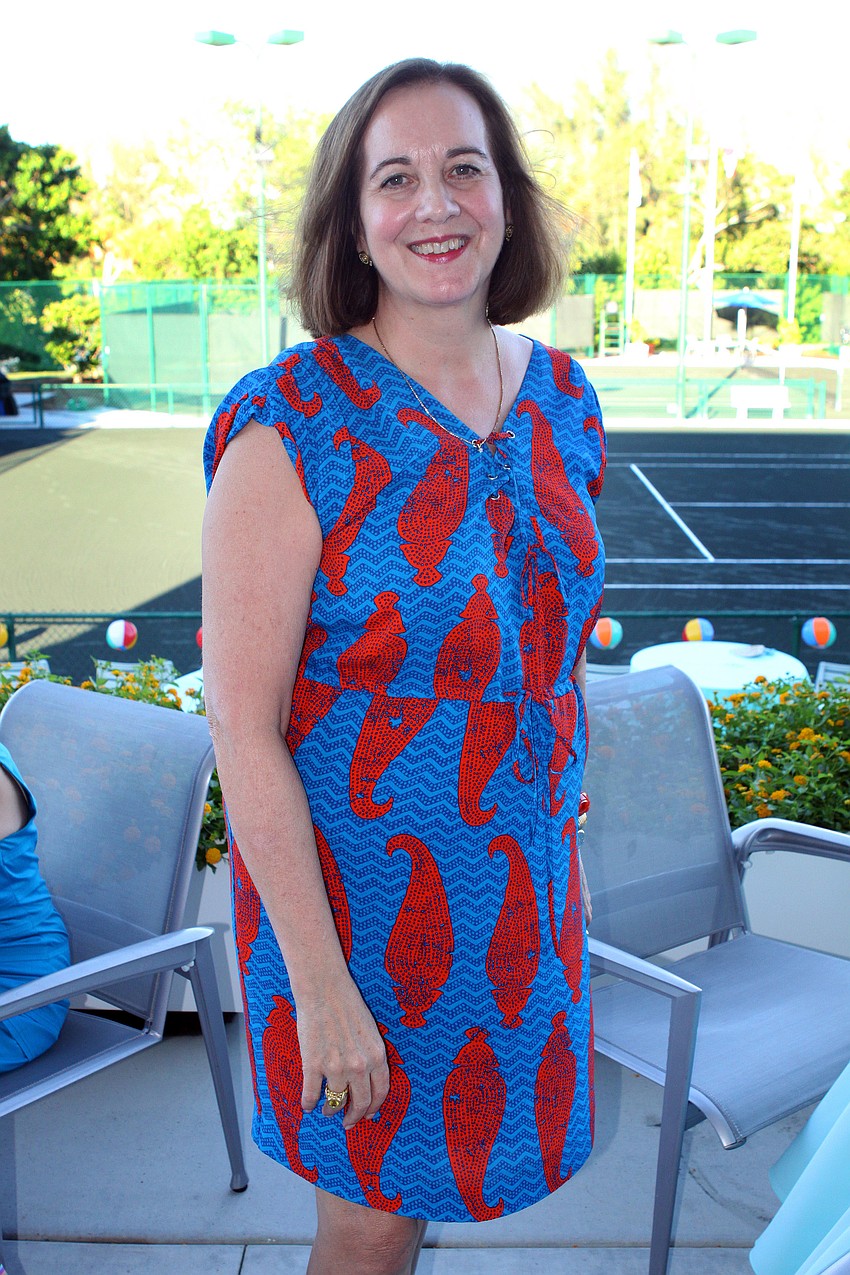 Ann Logan in her party perfect seahorse print dress