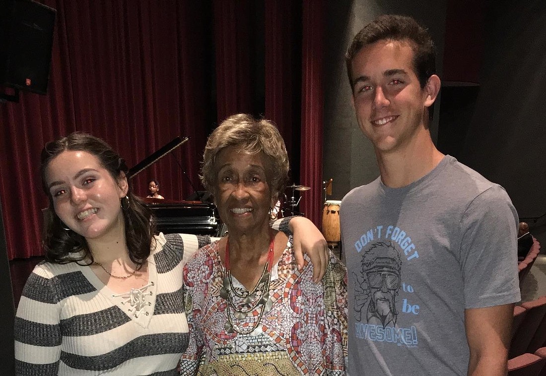 Muriel McCoy presents students Jessica Hile and Mario Saponaroon with jazz scholarships. Photo courtesy of the Northeast Florida Jazz Association