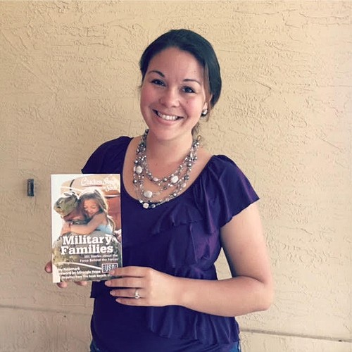 Angela Young poses with a copy of "Chicken Soup for the Soul: Military Families: 101 Stories about the Force Behind the Forces." (Photo courtesy of Angela Young(