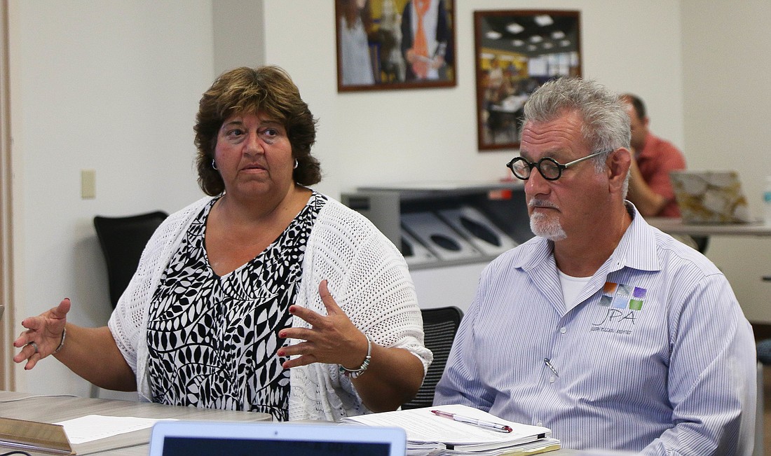 Flagler Auditorium Director Lisa McDevitt and local architect Joseph Pozzuoli speak to the School Board about the process of getting a bid for the Flagler Auditorium renovation project. Photo by Paige Wilson
