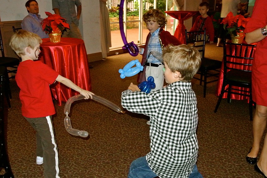 Benjamin Kruse, Will Hall and Harris Hawke have a balloon sword fight.