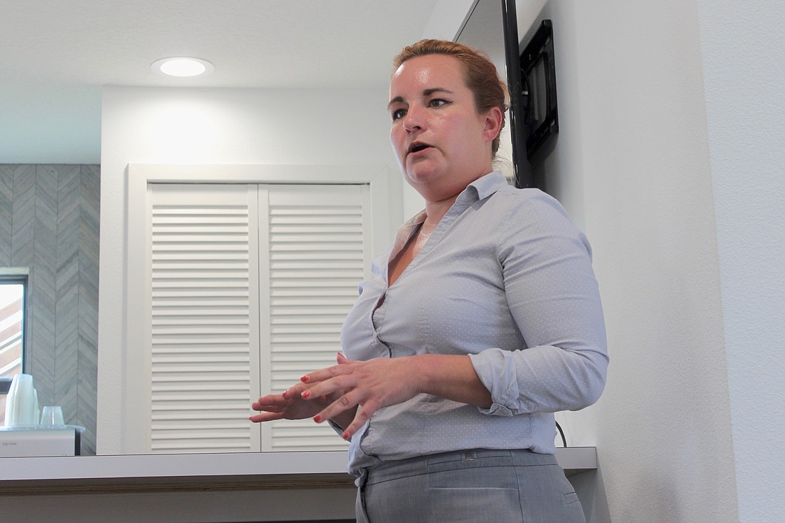 Former Flagler County Emergency Management Planner Jennifer Stagg talks about what the county's emergency services could improve on at a meeting with Flagler Beach business owners. Photo by Ray Boone
