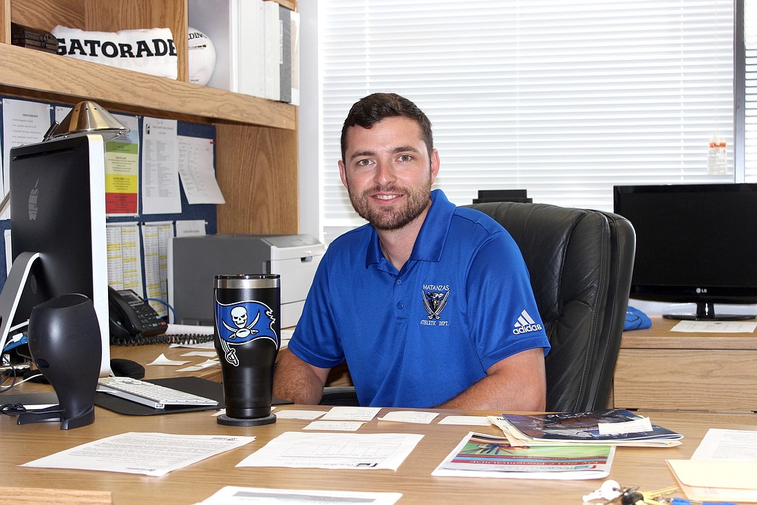 New Matanzas Athletics Director Zach Rigney sits in his office at school. Rigney was the former AD for Atlantic High School. Photo by Ray Boone