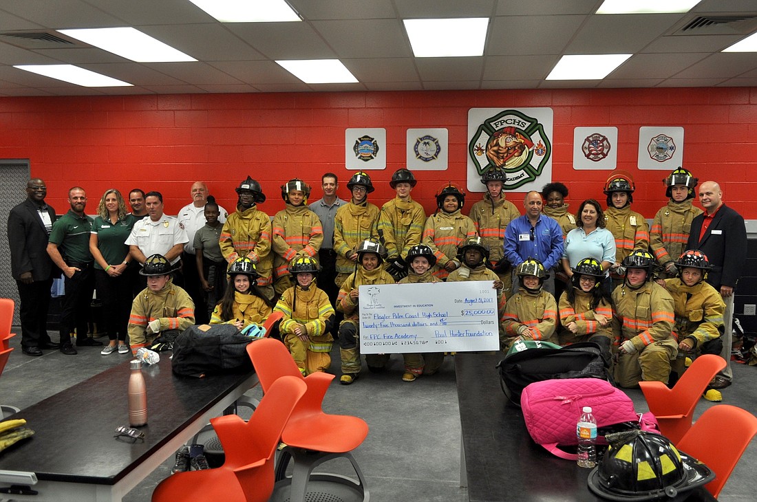 Flagler Palm Coast High School was presented with a $25,000 check from the Flagler County Education Foundation to help grow the school's Fire Leadership Academy. Photo by Ray Boone