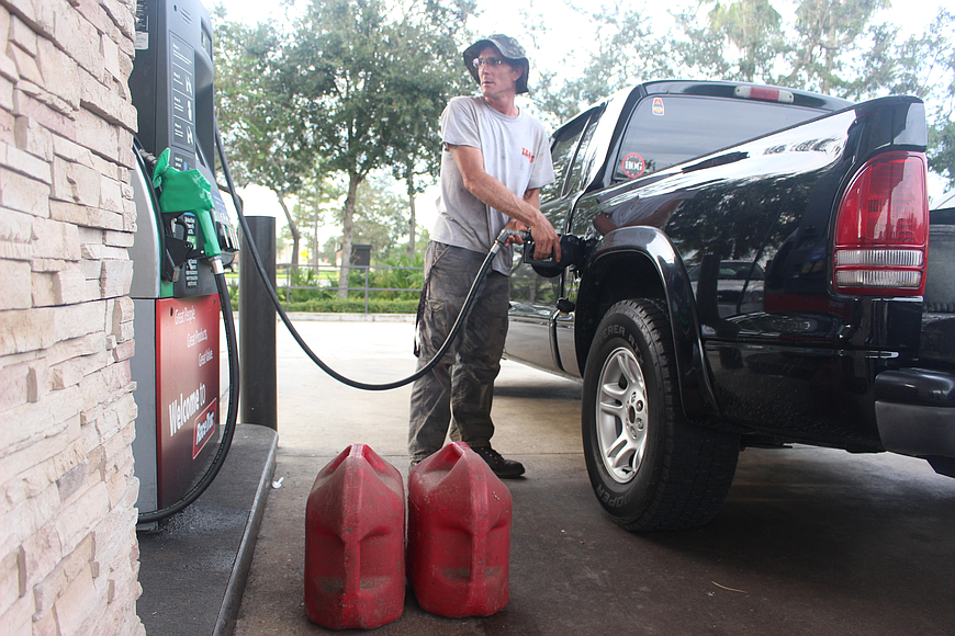Jerry Llewellyn fills up on gas for his truck at a RaceTrac gas station in preparation of Hurricane Irma. Photo by Jarleene Almenas
