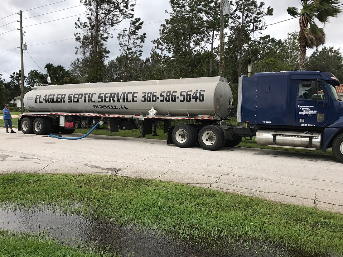 A tanker truck pumps wastewater out of a pump station . Photo courtesy of Cindi Lane