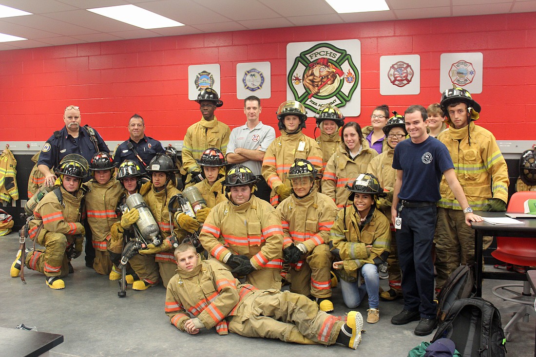 Palm Coast Firefighter David Faust, Lt. Jeff Poeira and intern Masun Nemec deliver Firefighting Air Pack equipment to instructor Lt. Andrew Keppler and students of the FPC Fire Academy. Photo courtesy of Cindi Lane