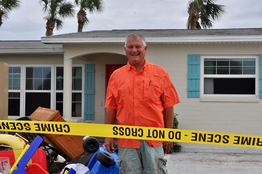 Bart Tilton stands in front of his house that flooded during Hurricane Irma. Photo by Ray Boone