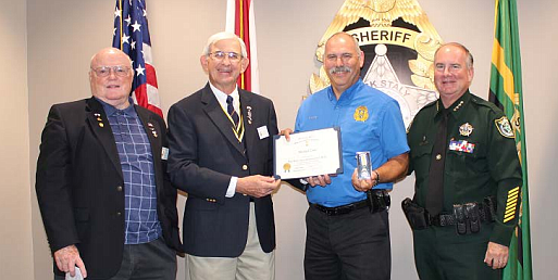 From left-to-right: Compatriot David Kelsey, President Randall Morris, Sgt. Mike Lutz and Sheriff Rick Staly. Photo courtesy of the Flagler County Sheriff's Office