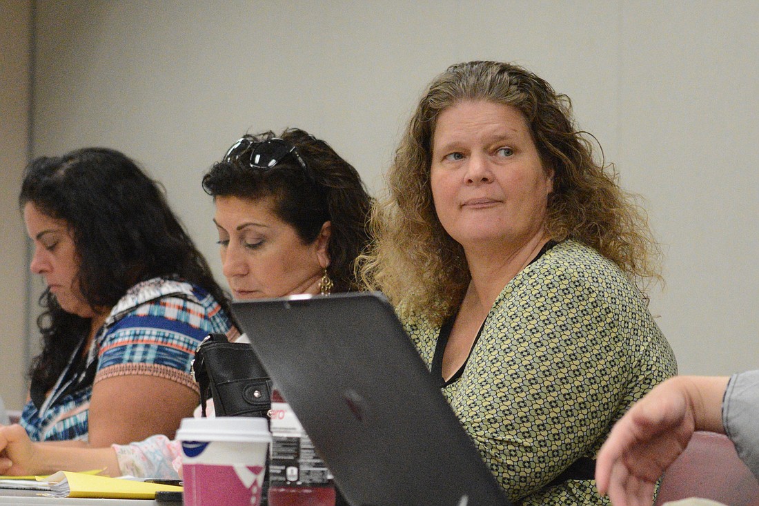 Flagler Volunteer Services Executive Director Suzy Gamblain listens to a FEMA representative during a meeting Sept. 25. Photo by Jonathan Simmons